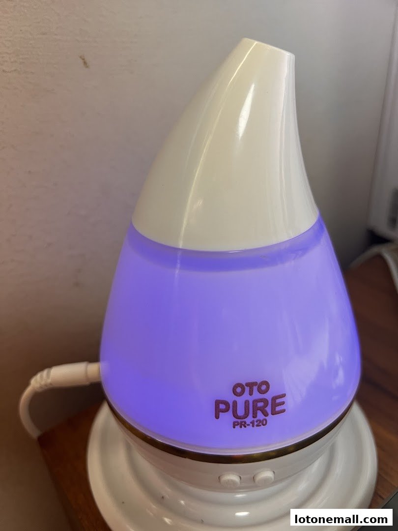 A close-up of an OTO PURE PR-120 diffuser with purple light.