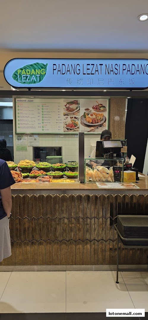 A food stall with a menu board displaying various dishes and prices, and a selection of food items.