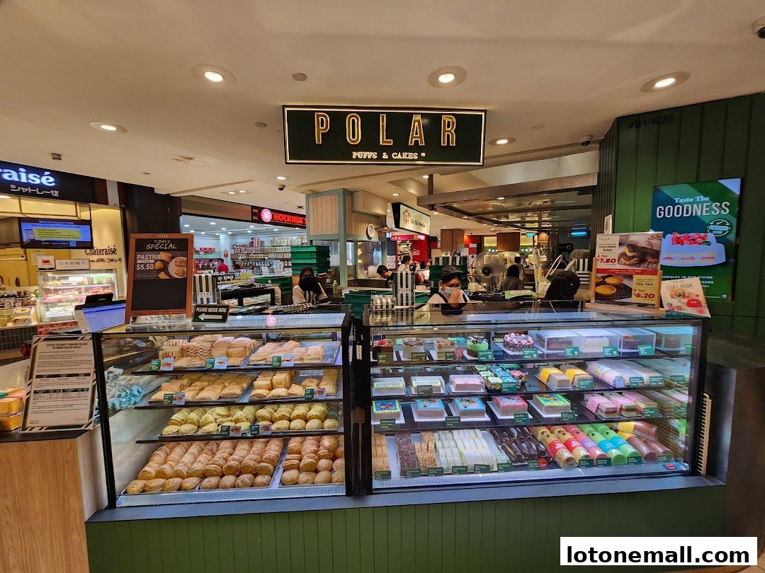 A Polar Puffs & Cakes shop with display cases filled with pastries and cakes.