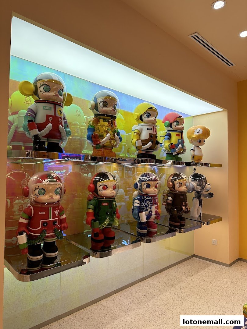 Display of collectible astronaut-themed figures in a retail store.