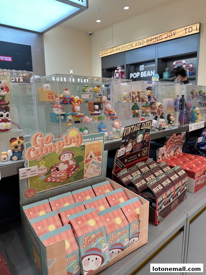 A POP MART store interior showcasing various collectible toys and blind boxes, with a focus on 'Go Camping' and 'Vintage Zakka' series.