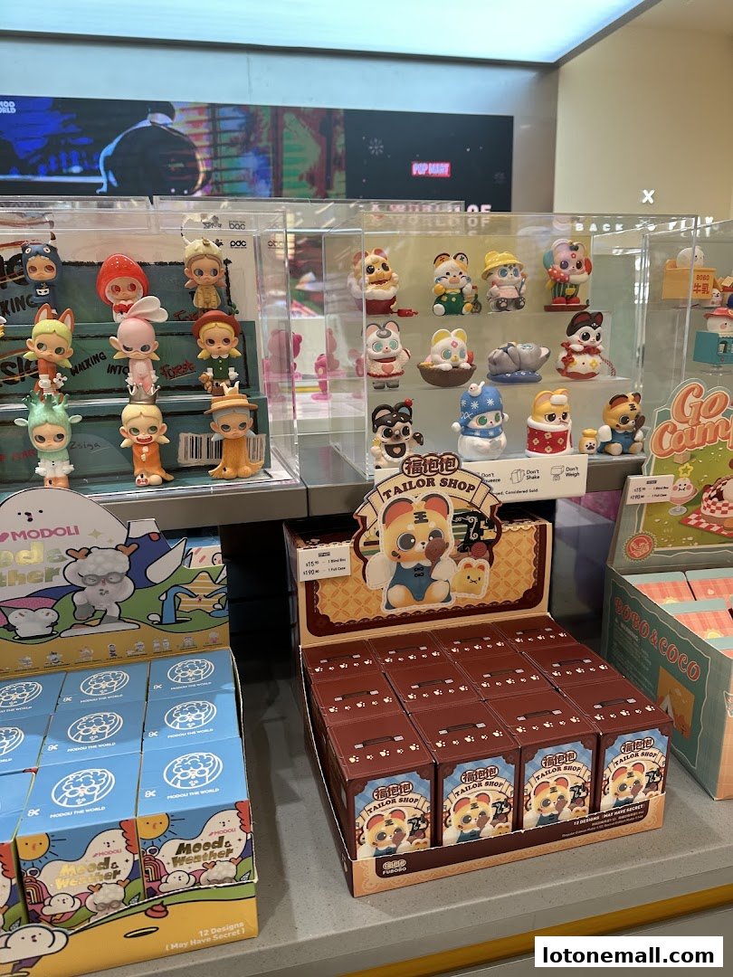A display of collectible blind box toys from POP MART, featuring various characters and series.