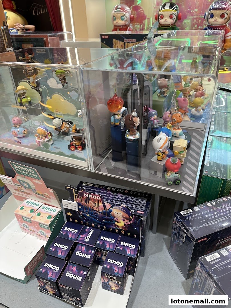A display of collectible blind box toys from POP MART, featuring various characters and series.