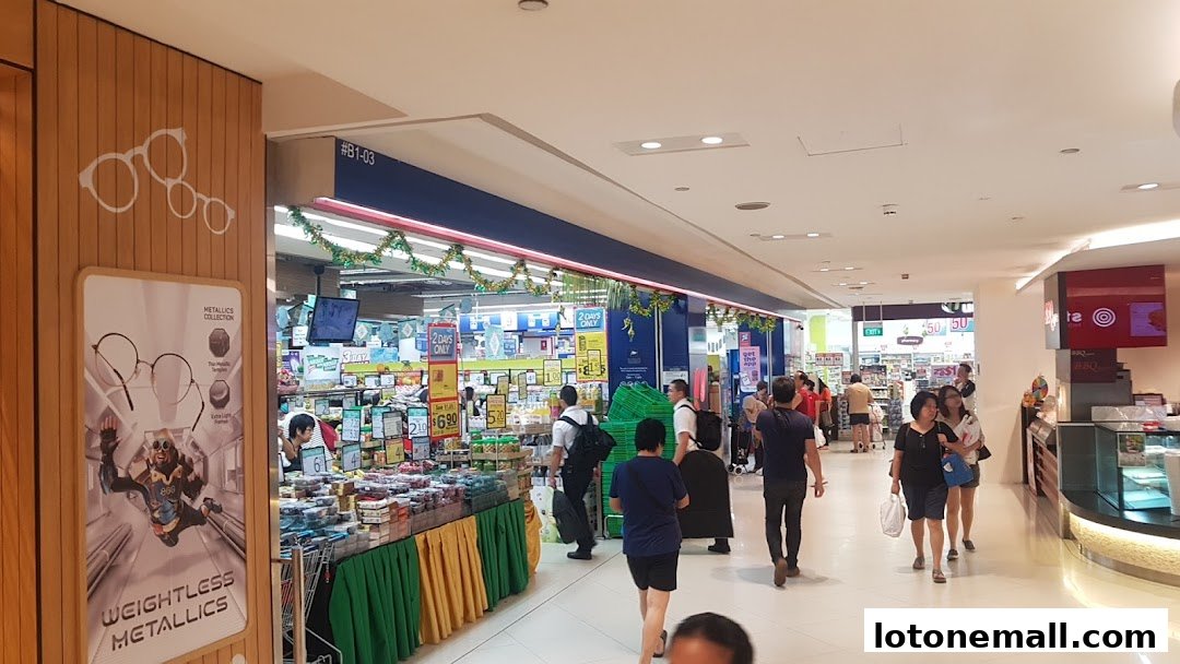 A busy shopping mall corridor with a POSB bank branch and various retail stores.
