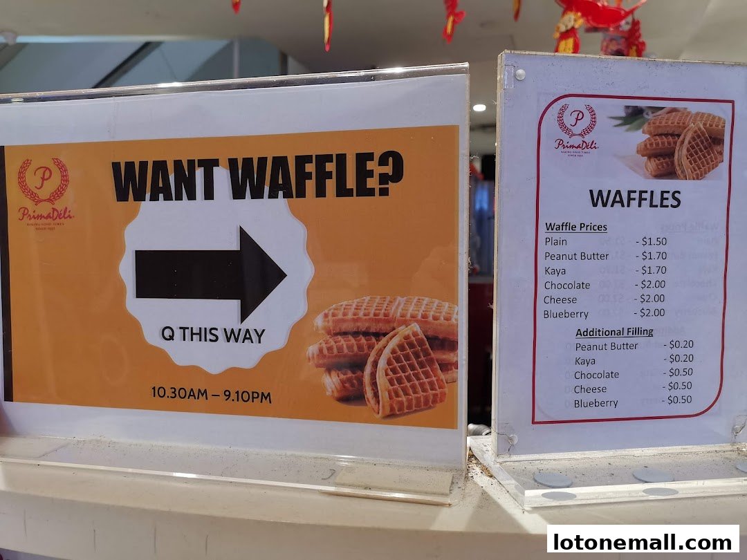 A sign for PrimaDéli offering waffles with various fillings and prices, plus operating hours.