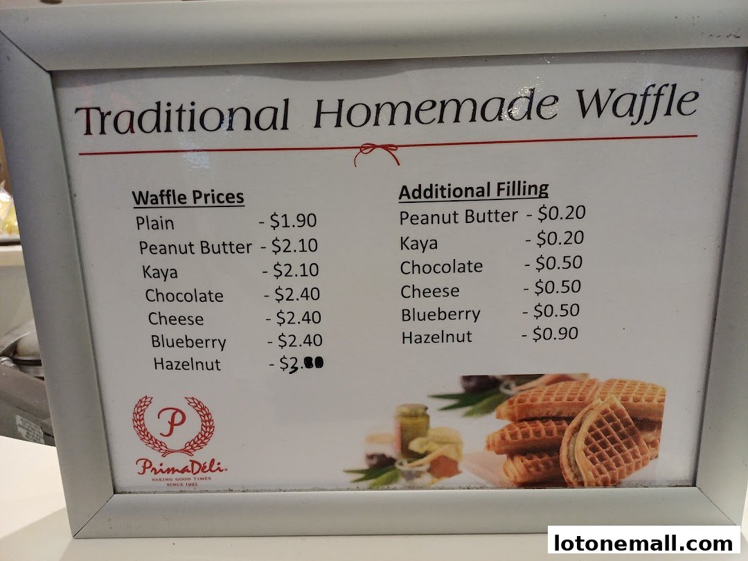 A menu board displaying prices for traditional homemade waffles and additional fillings.