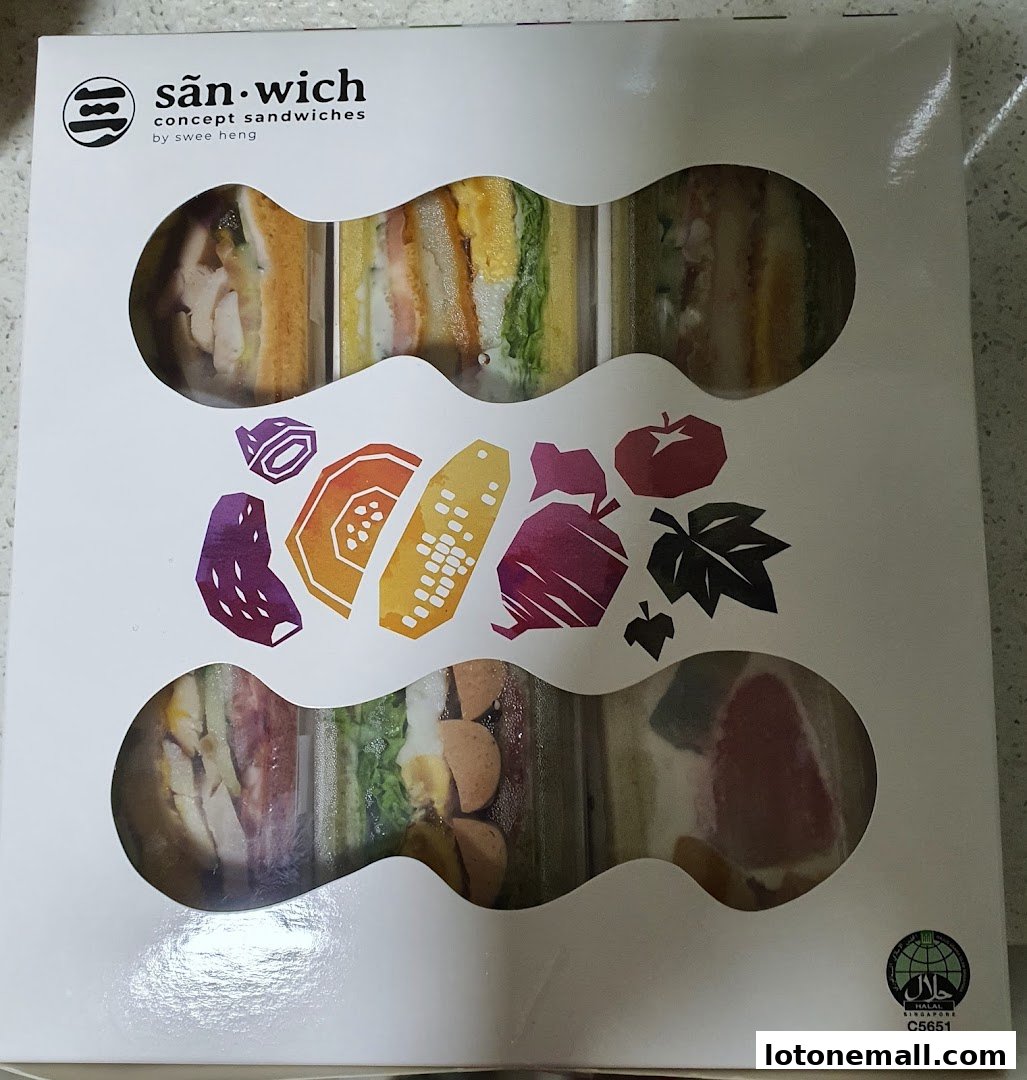 A box of assorted concept sandwiches from San.wich by Swee Heng, showcasing colorful fillings.