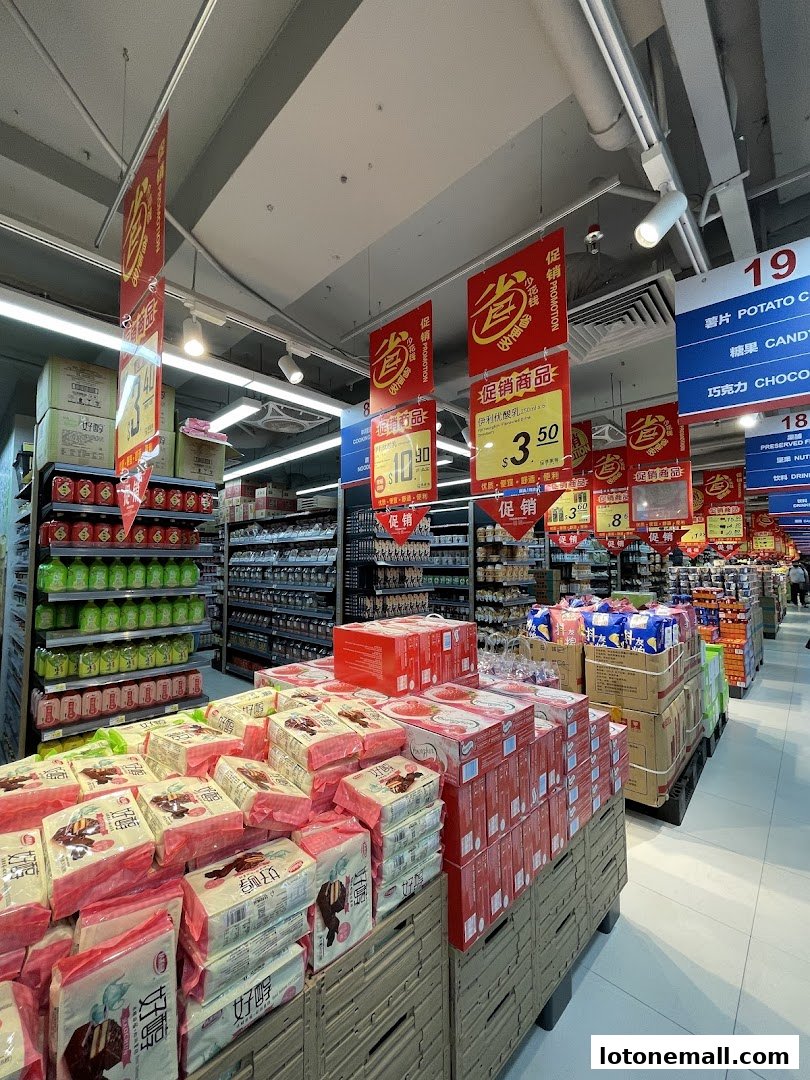 A supermarket aisle with promotional displays of snacks and beverages.