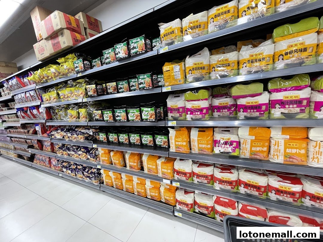 Shelves stocked with various packaged food items, including noodles and snacks.