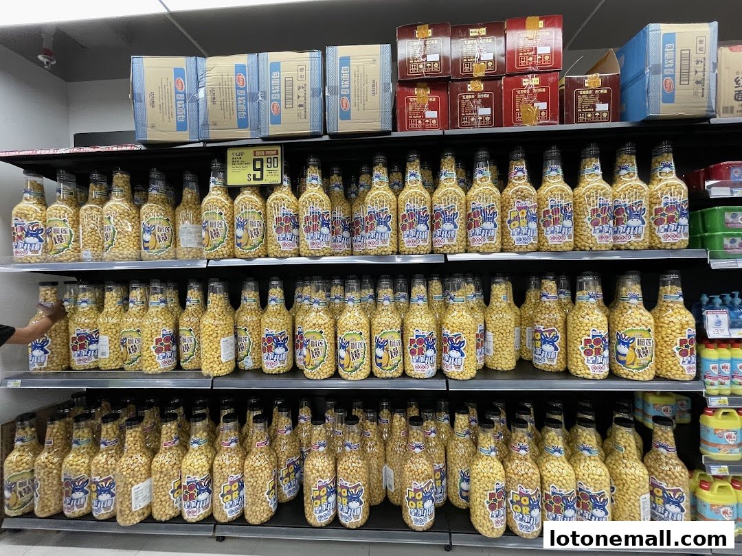 Shelves stocked with bottles of snacks, featuring cartoon donkey labels and a price tag.