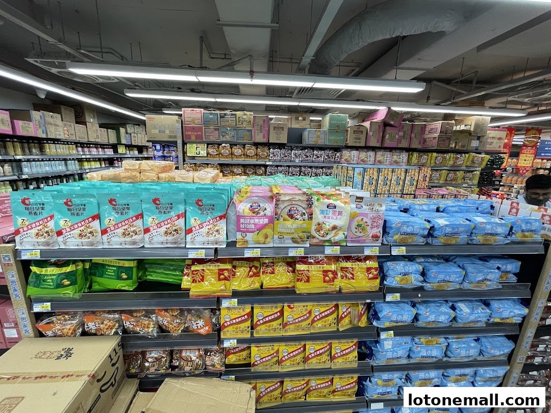 Shelves stocked with various packaged snacks and cereals in a supermarket.
