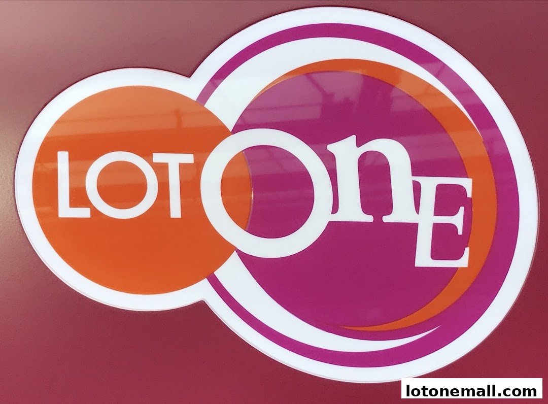 A close-up of the 'LOT ONE' logo with orange and purple circles.