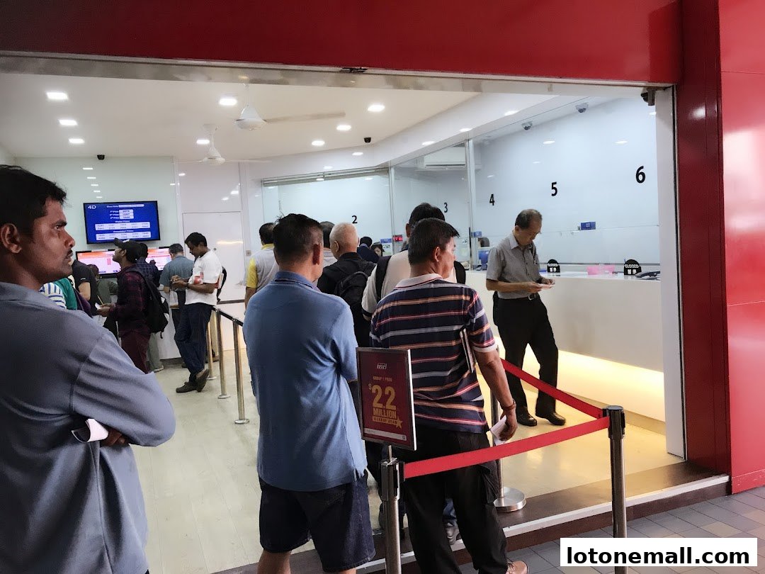 People queuing inside a Singapore Pools NTUC FairPrice outlet.