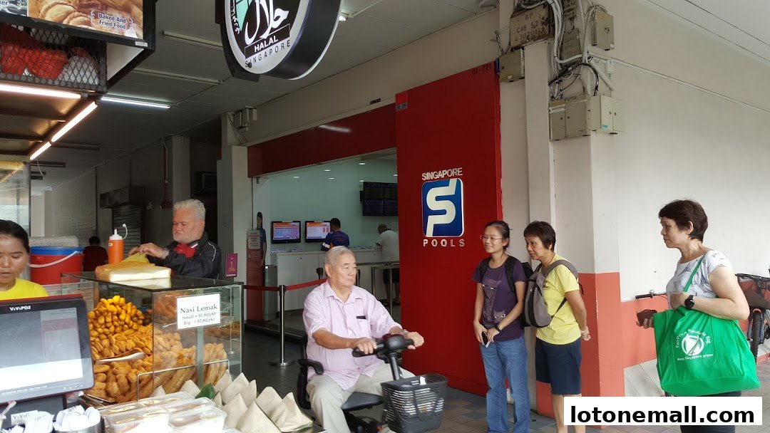 A Singapore Pools outlet with a food stall selling Nasi Lemak and fried snacks.