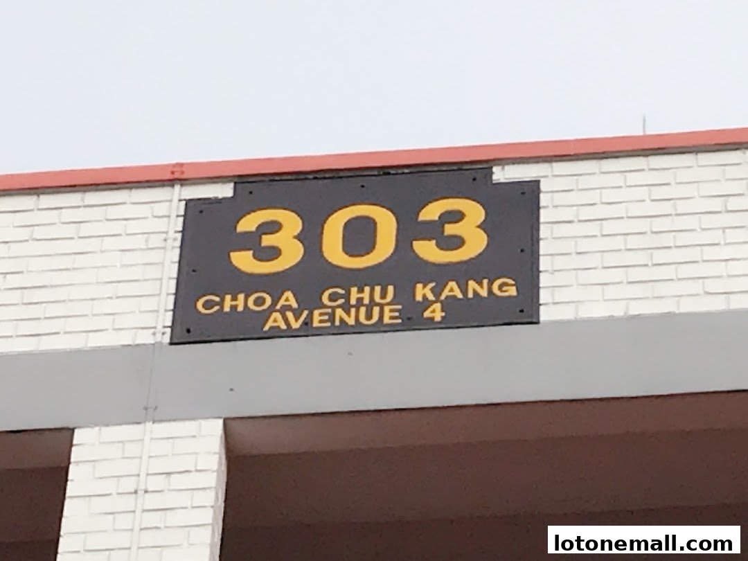 A sign displaying the address 303 Choa Chu Kang Avenue 4.