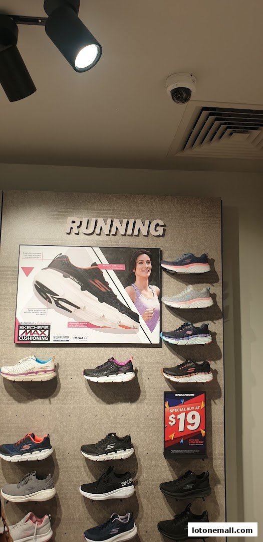 Skechers store display featuring various running shoes and a special offer sign.