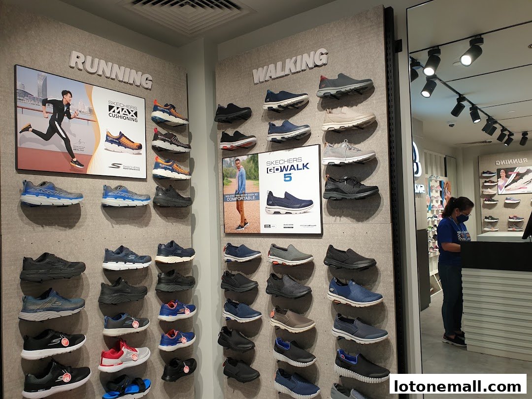 Skechers store interior showcasing running and walking shoes displayed on walls.