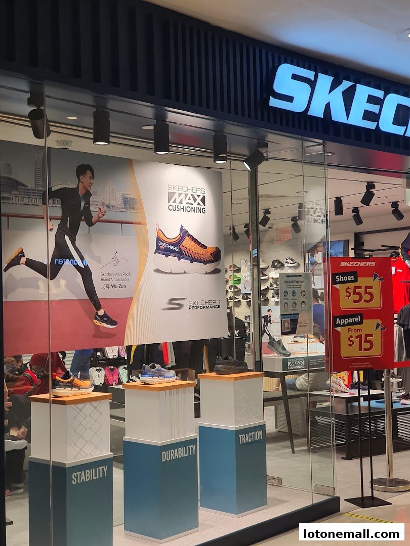 Skechers store window display featuring running shoes and promotional signage.