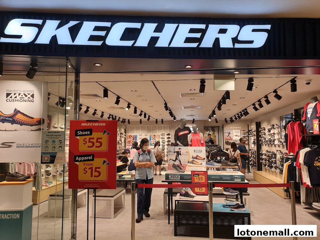 The Skechers store entrance features a large illuminated sign and promotional displays for shoes and apparel.
