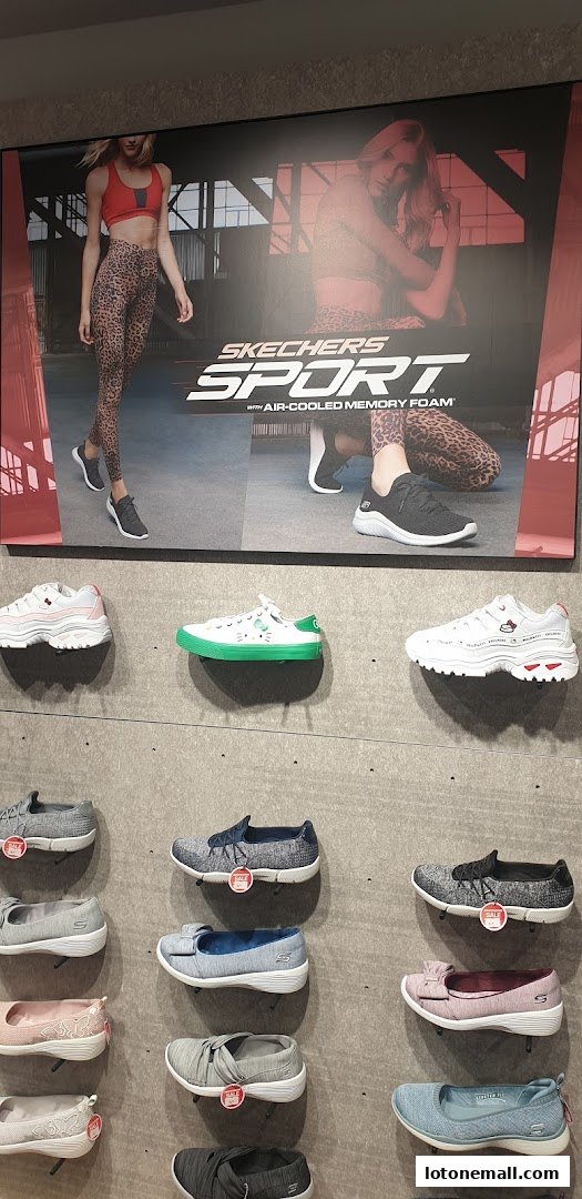 Skechers store display featuring athletic shoes and casual footwear for women.