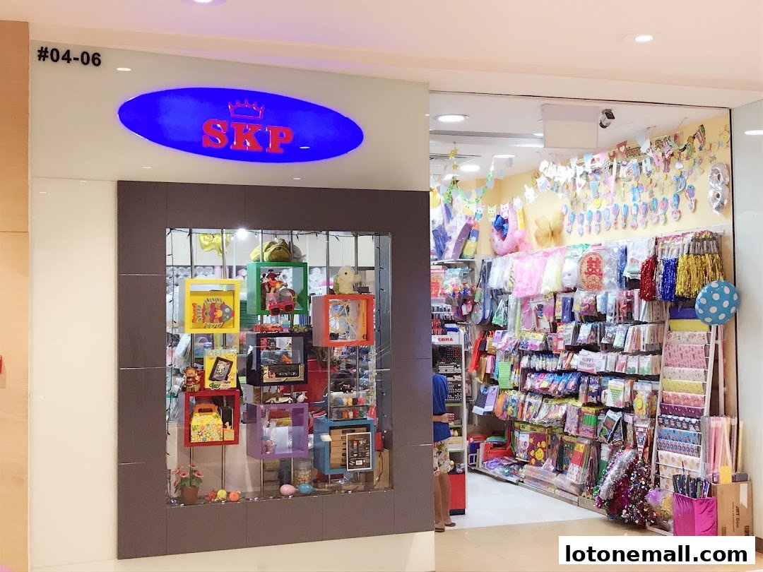The entrance of SKP, a shop filled with party supplies and toys, decorated with balloons and banners.
