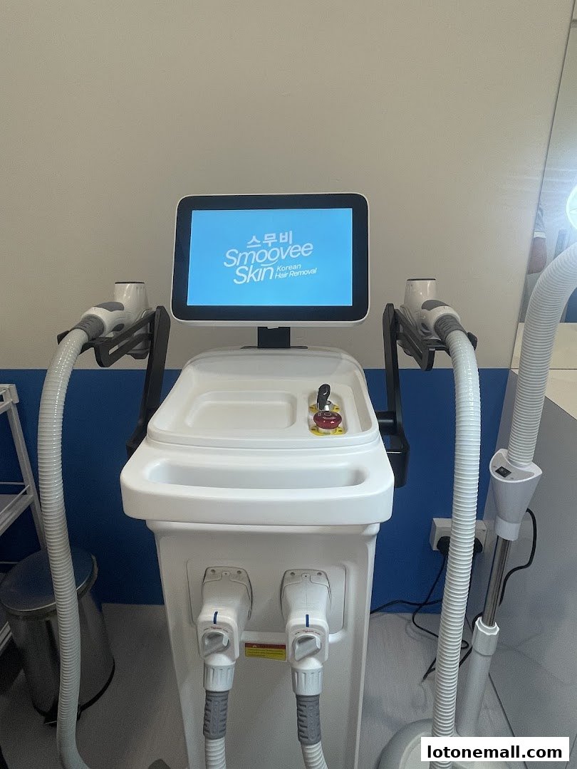 A modern hair removal machine with the Smoovee Skin Korean Hair Removal logo displayed on its screen.