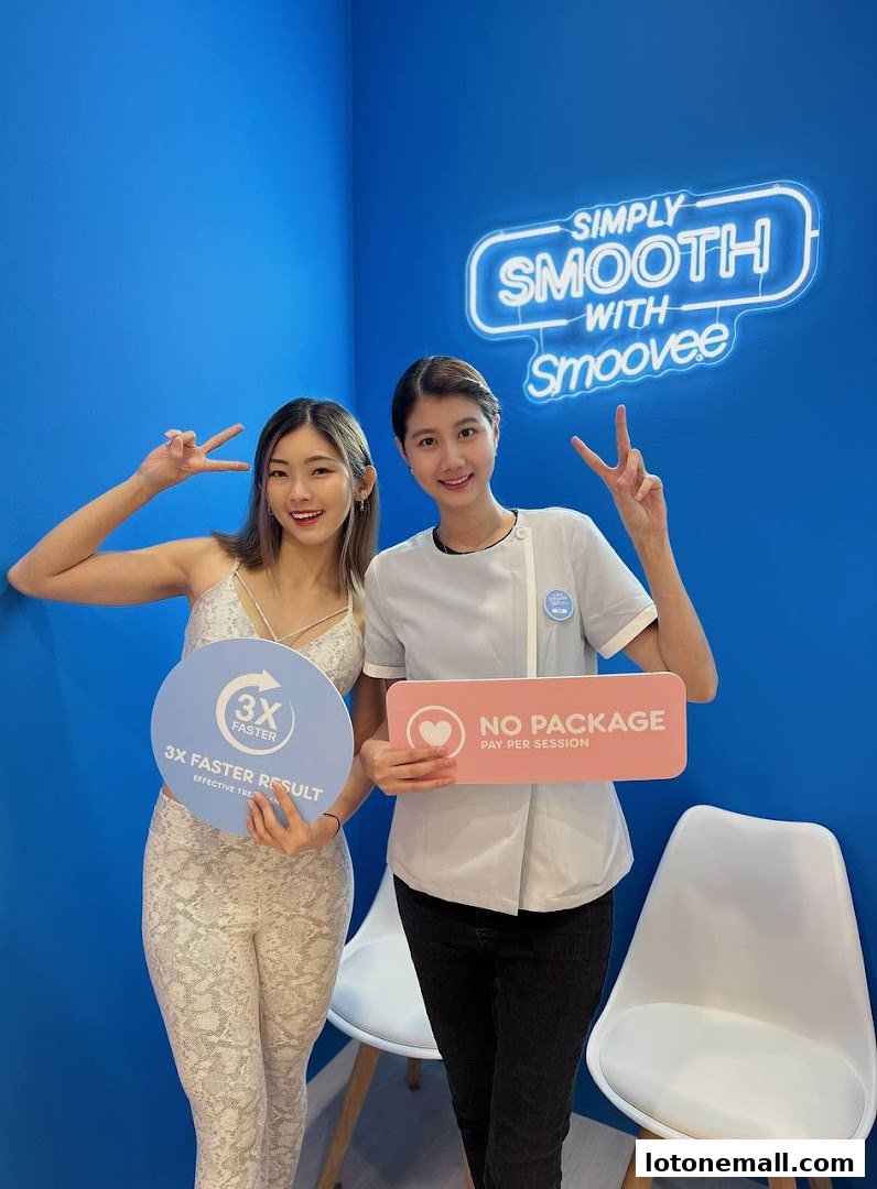 Two women posing with signs promoting hair removal services.