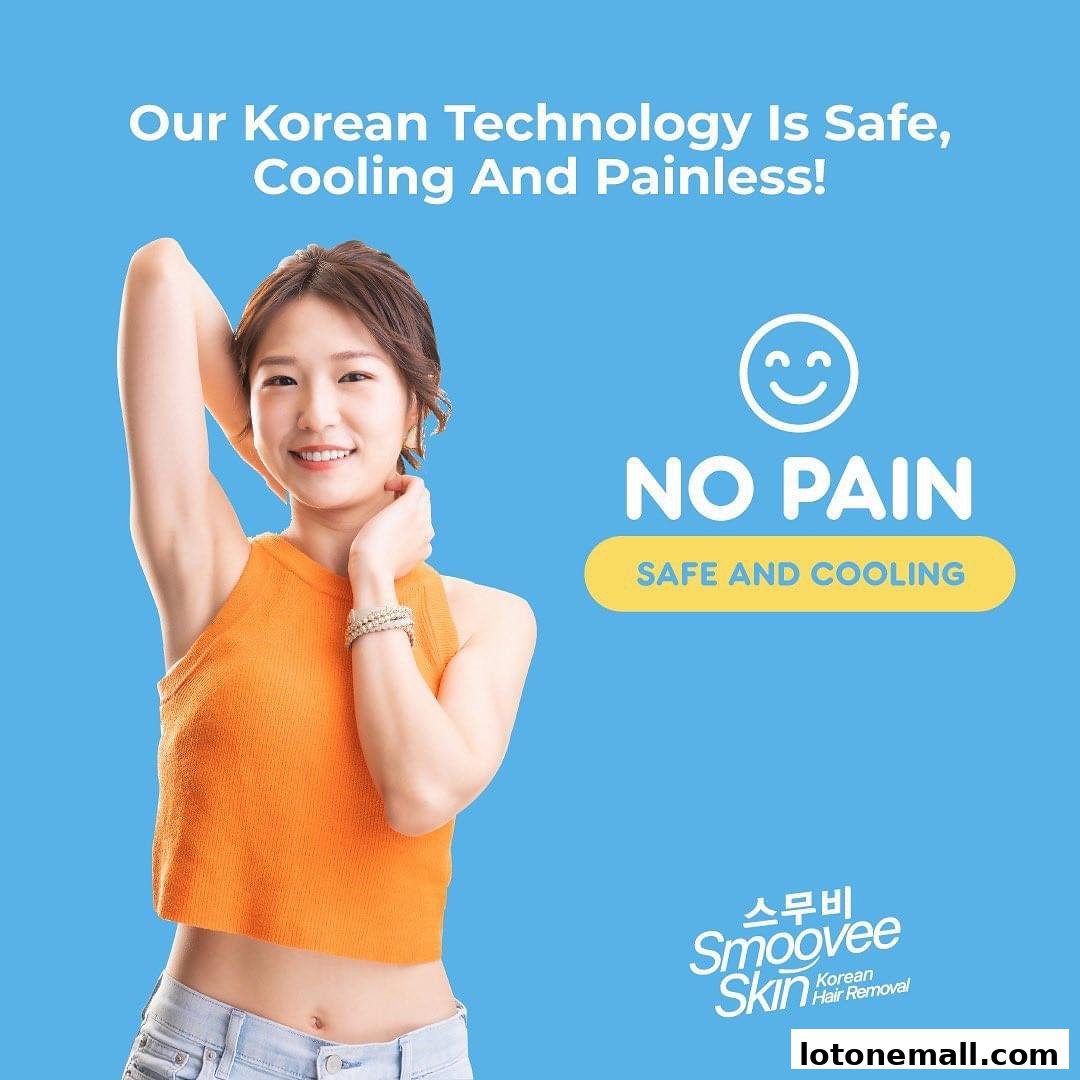 A woman smiles while showcasing her smooth underarm, highlighting pain-free hair removal.