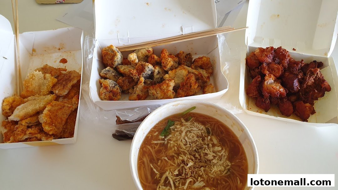 A spread of fried snacks and a bowl of noodles from Snackz It! Lot One.