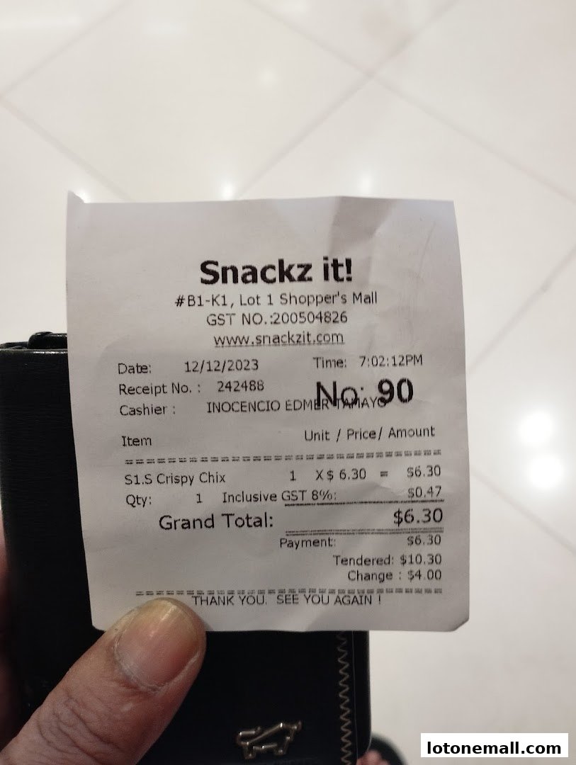 A receipt from Snackz It! showing a purchase of Crispy Chix.