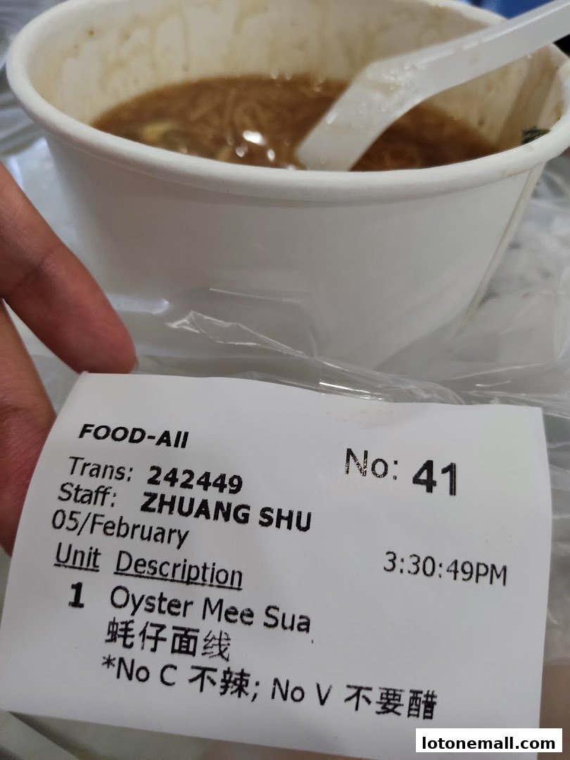 A receipt for Oyster Mee Sua from Snackz It! Lot One with order details.
