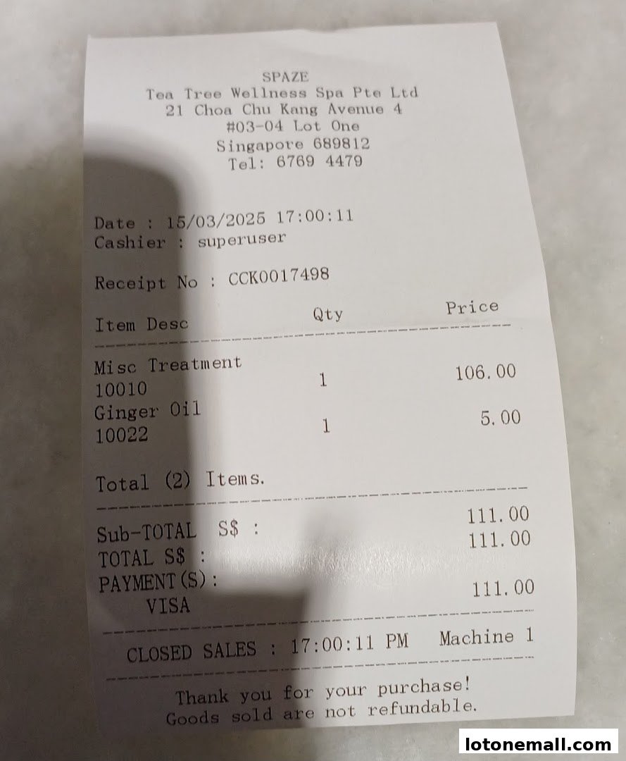 A receipt from SPAZE Tea Tree Wellness Spa showing a misc treatment and ginger oil purchase.