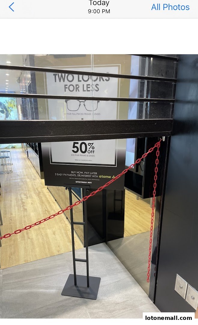 Spectacle Hut shop front with a 'Two Looks for Less' promotion and 50% off offer.