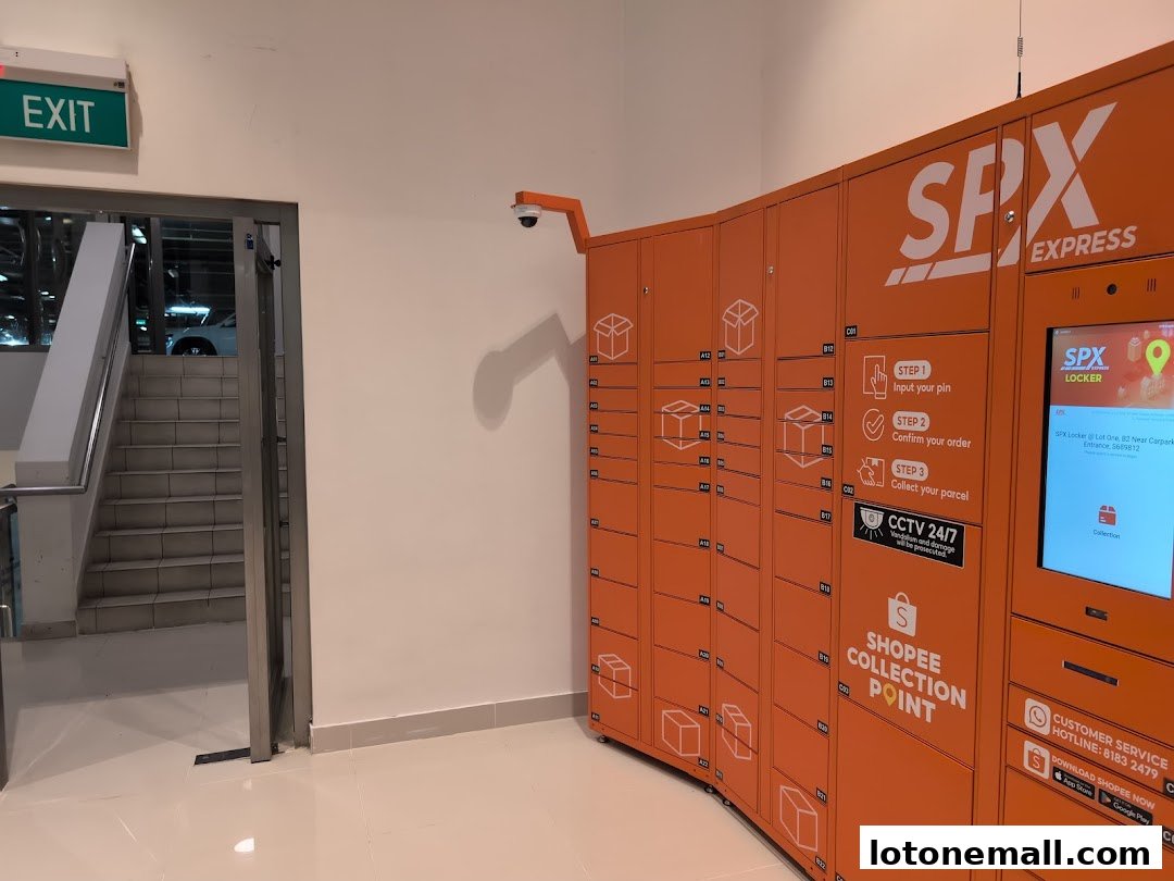An SPX Express locker collection point with orange lockers and a digital screen.