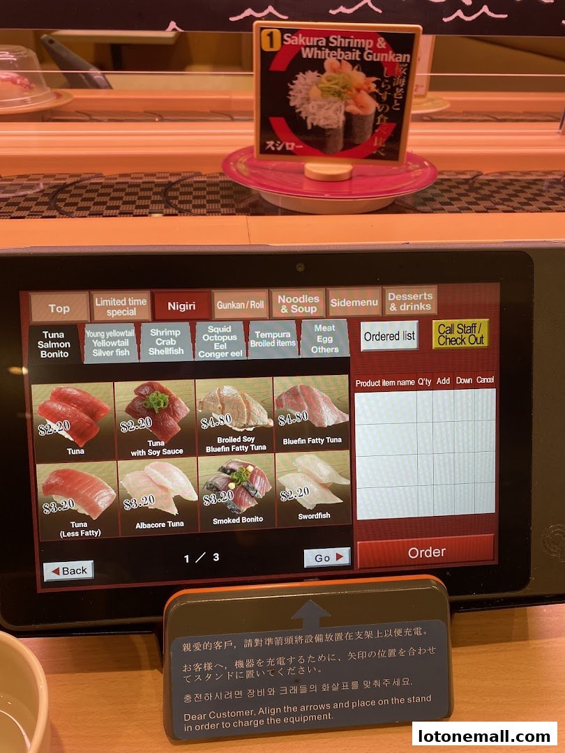 A touch screen menu displaying various sushi items with prices and images.