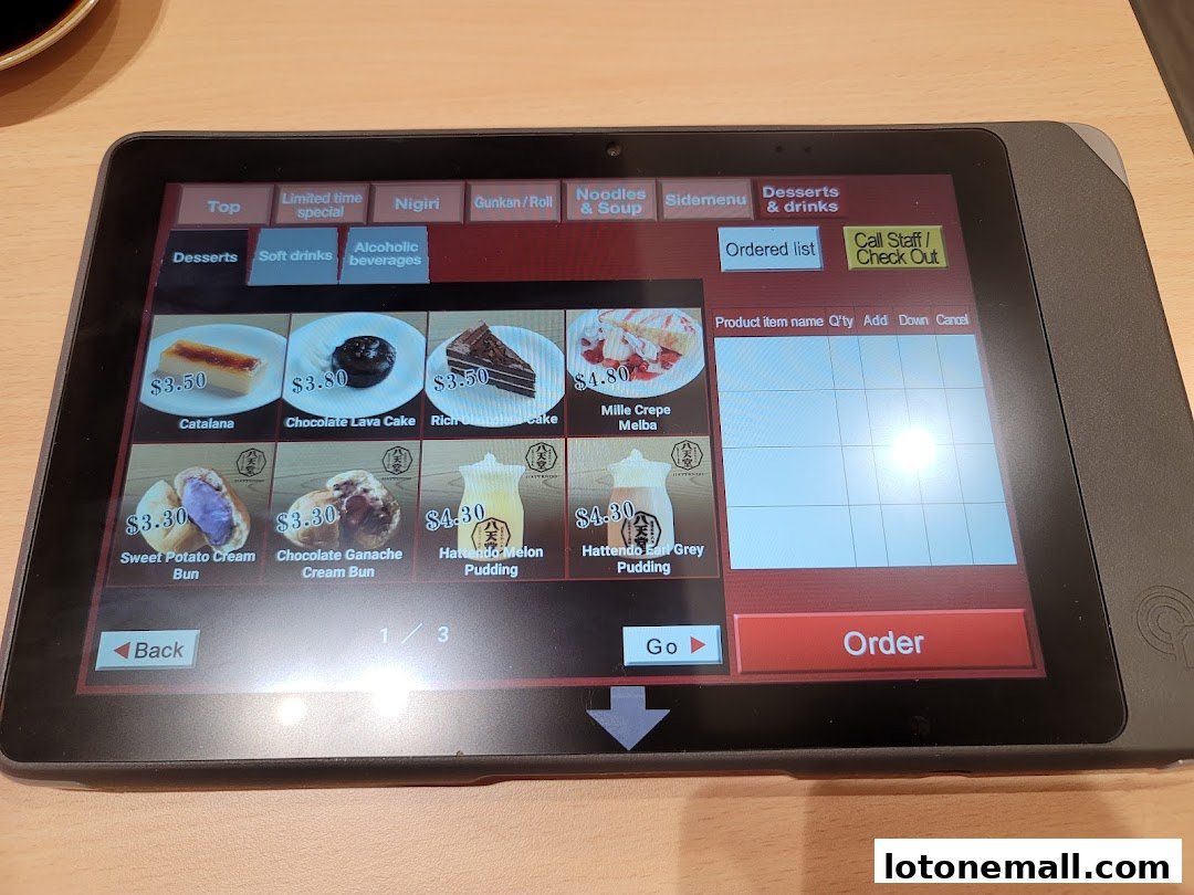 A tablet displaying a dessert menu with prices and images of various sweet treats.