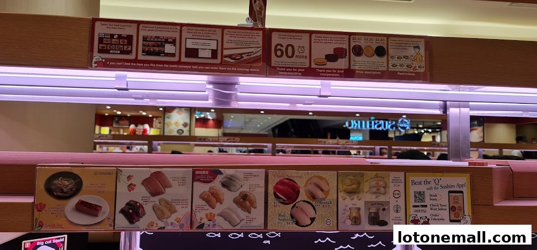 Sushiro Lot One features a conveyor belt sushi display with various menu items and ordering instructions.