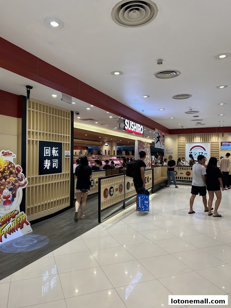 The entrance to Sushiro Lot One, a sushi restaurant, with customers entering and waiting.