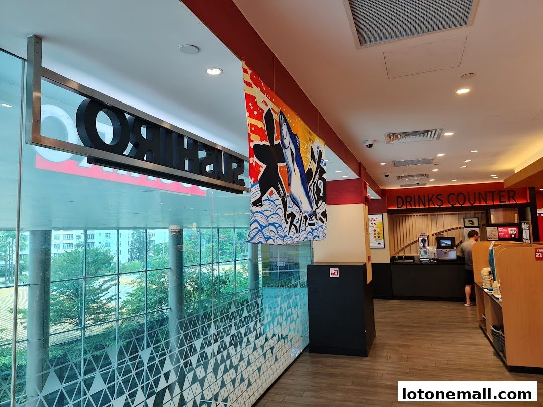 Interior view of Sushiro Lot One showing the drinks counter and seating area.