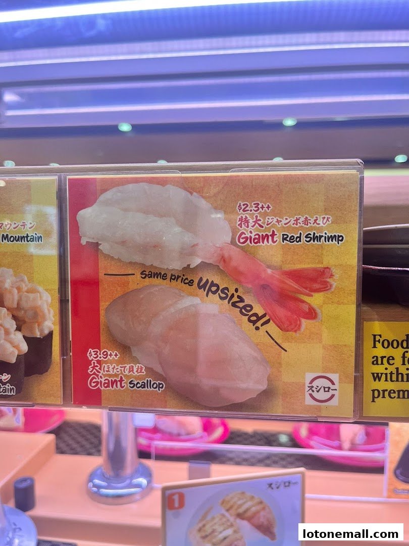 Close-up of two sushi dishes: Giant Red Shrimp and Giant Scallop.