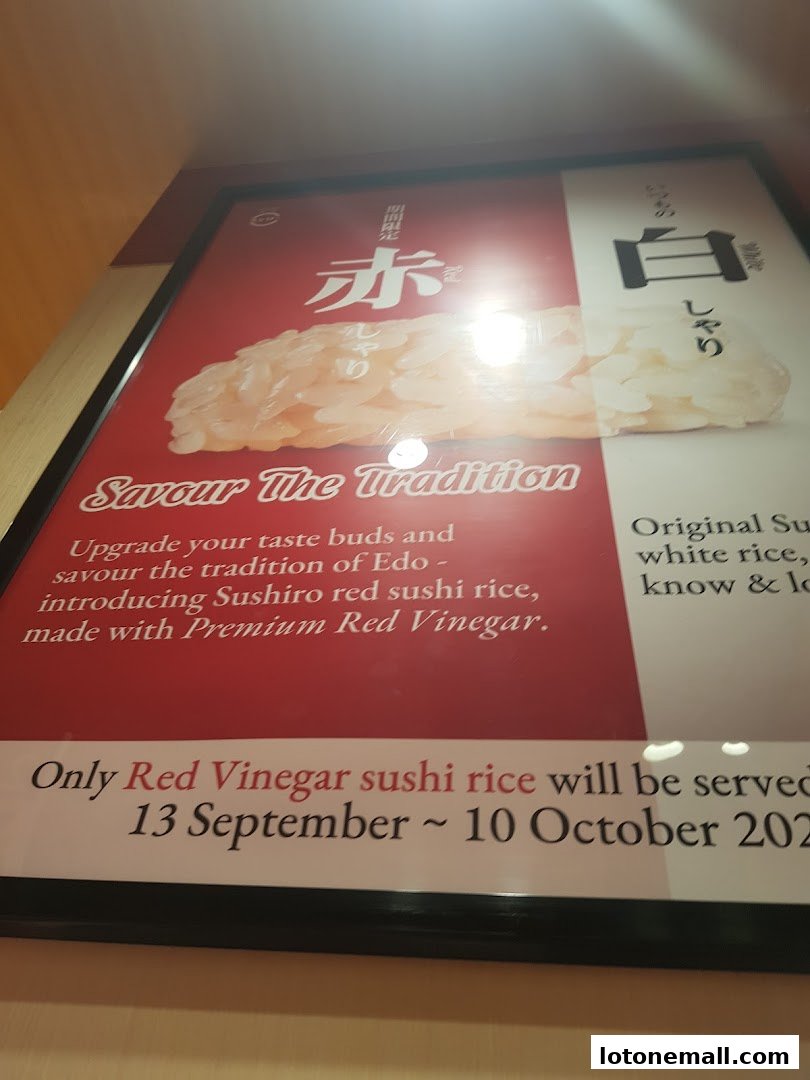 A promotional poster for Sushiro's red sushi rice made with premium red vinegar.