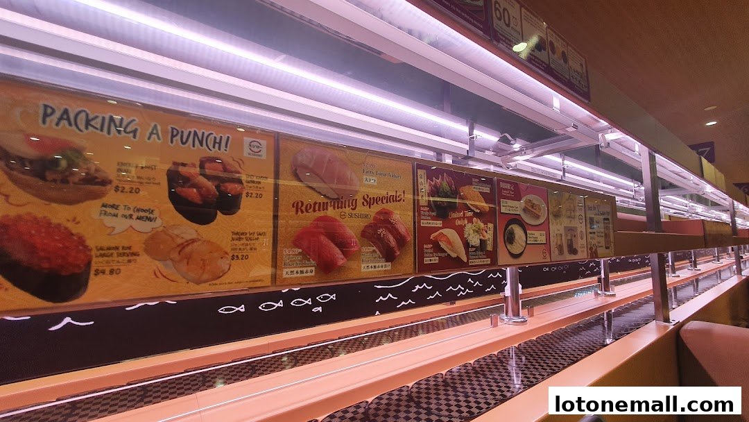 A conveyor belt sushi restaurant with various sushi dishes displayed on a menu board.
