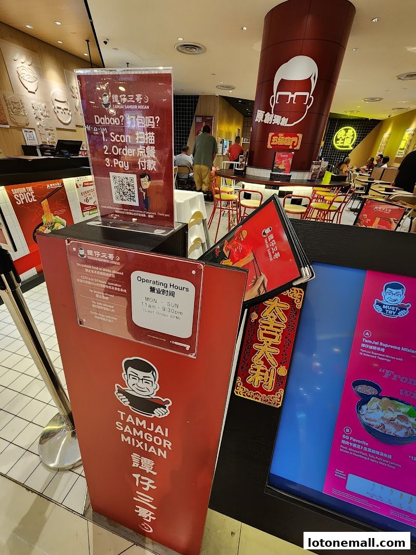 A display stand with ordering instructions and menus for TamJai SamGor Mixian.