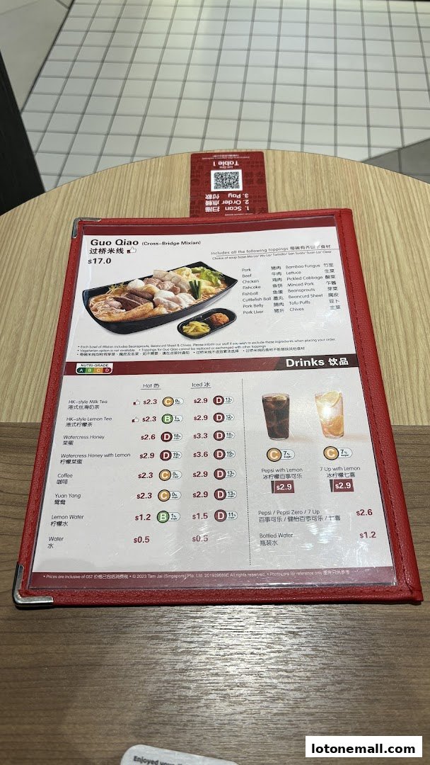 A menu from TamJai SamGor Mixian featuring their signature Guo Qiao Mixian and various drinks.
