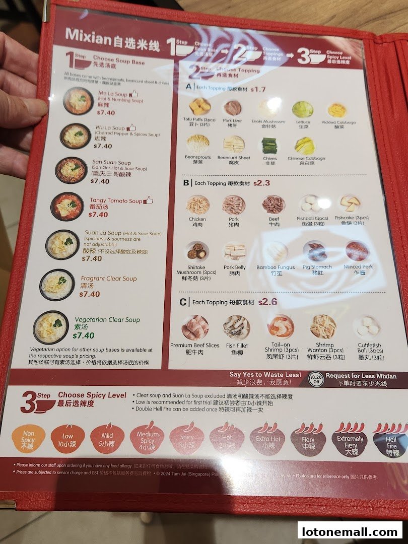 A menu for TamJai SamGor Mixian showing soup bases, toppings, and spicy levels.