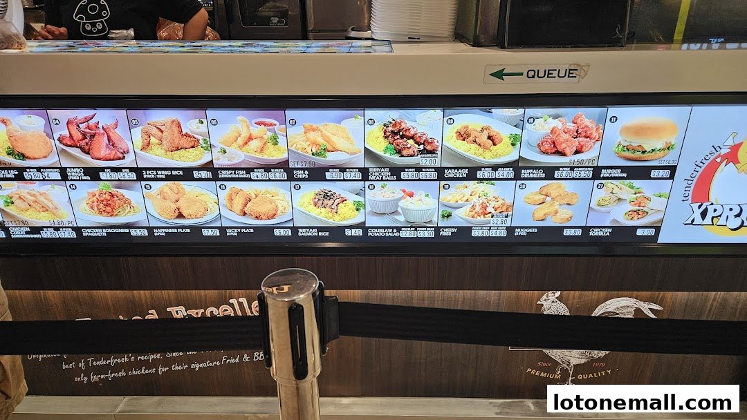 A digital menu board displaying various fried chicken and side dish options with prices.