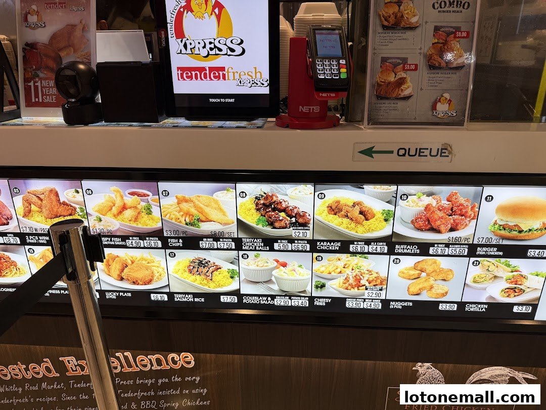 A brightly lit menu display showcasing various fried chicken meals and sides at Tenderfresh Xpress.