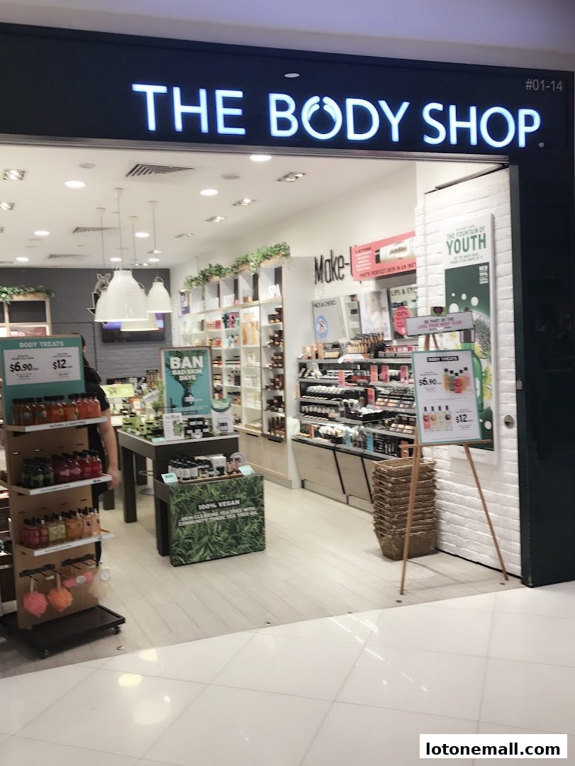 The Body Shop storefront with products displayed inside and promotional signs outside.