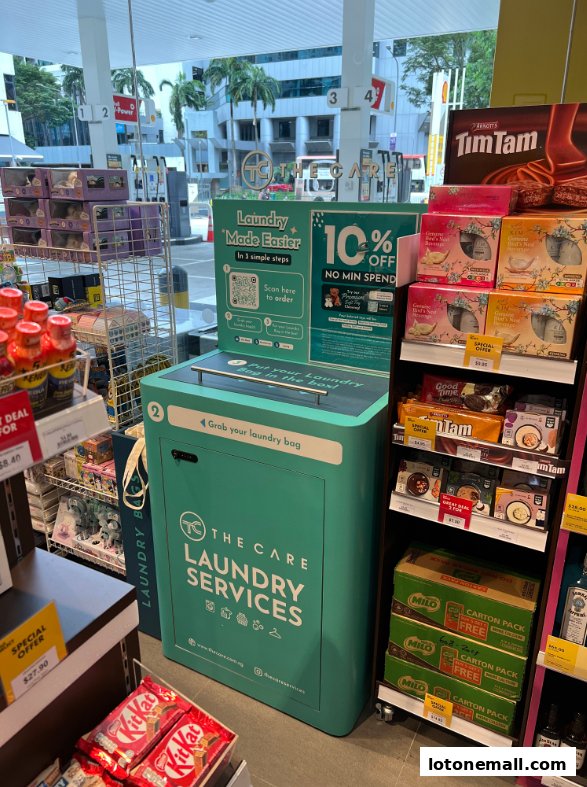 A display for laundry services with promotional signage and various retail products.