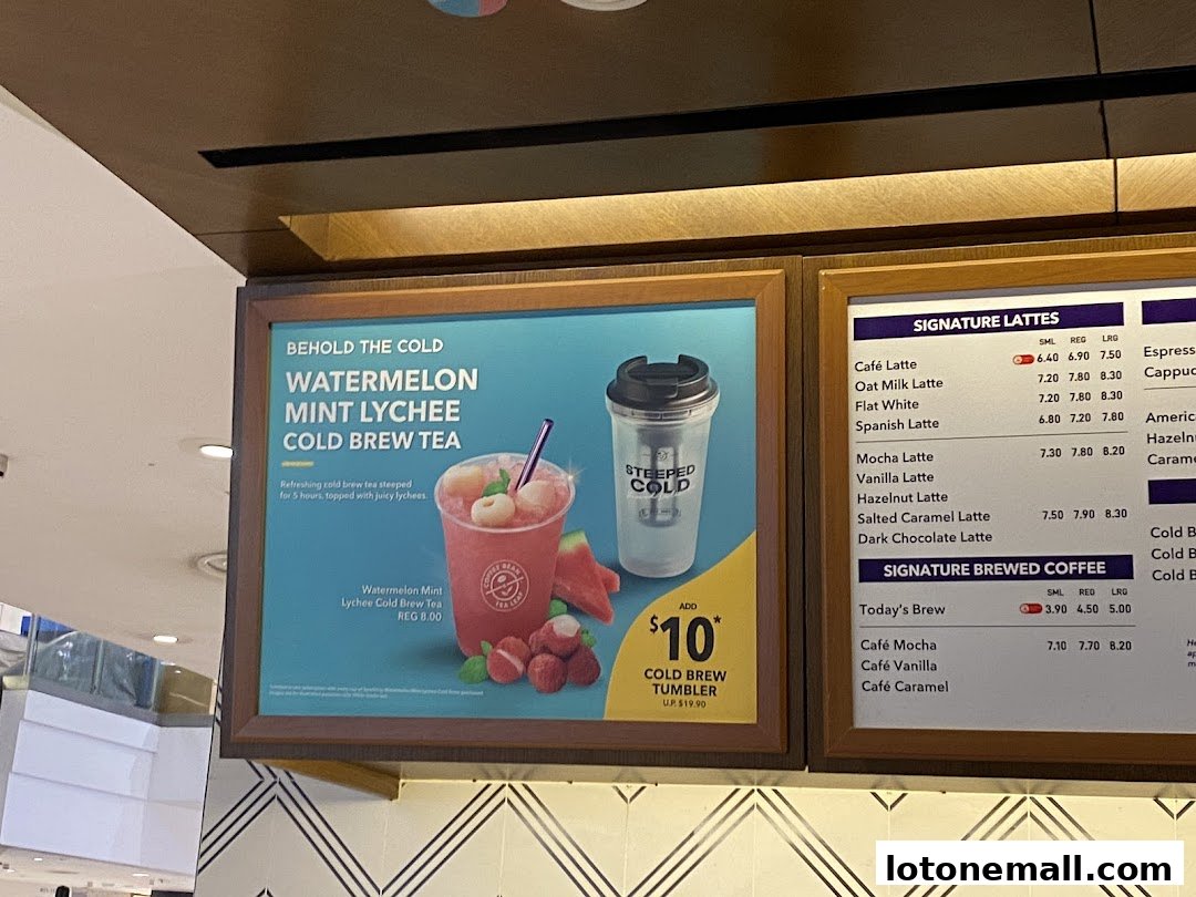 A menu board for The Coffee Bean & Tea Leaf, featuring signature lattes and cold brew tea.